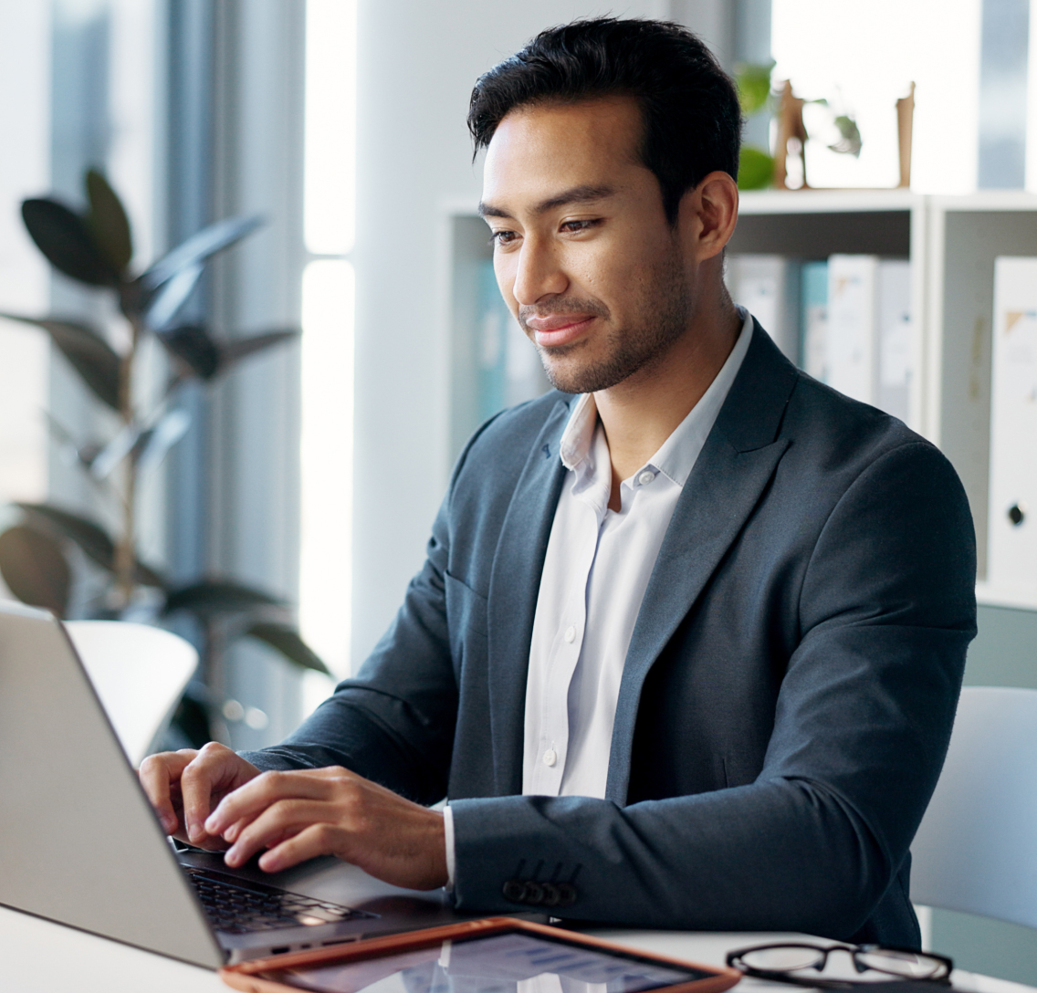 A male clinical development professional using his laptop to digitally design a modern clinical trial