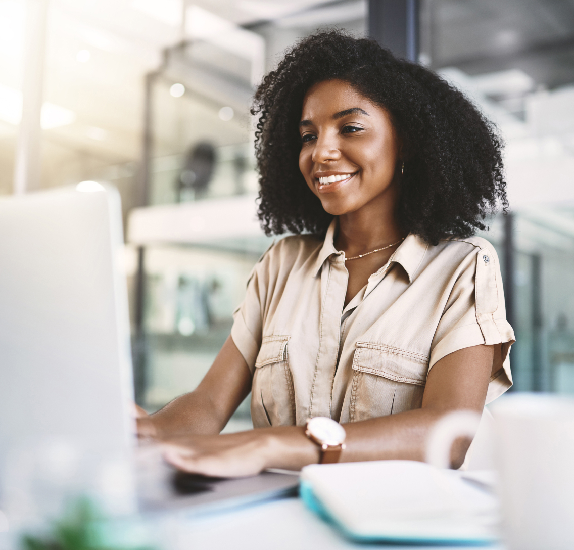 A female clinical development professional smiling confidently after using AI to design a modern clinical trial